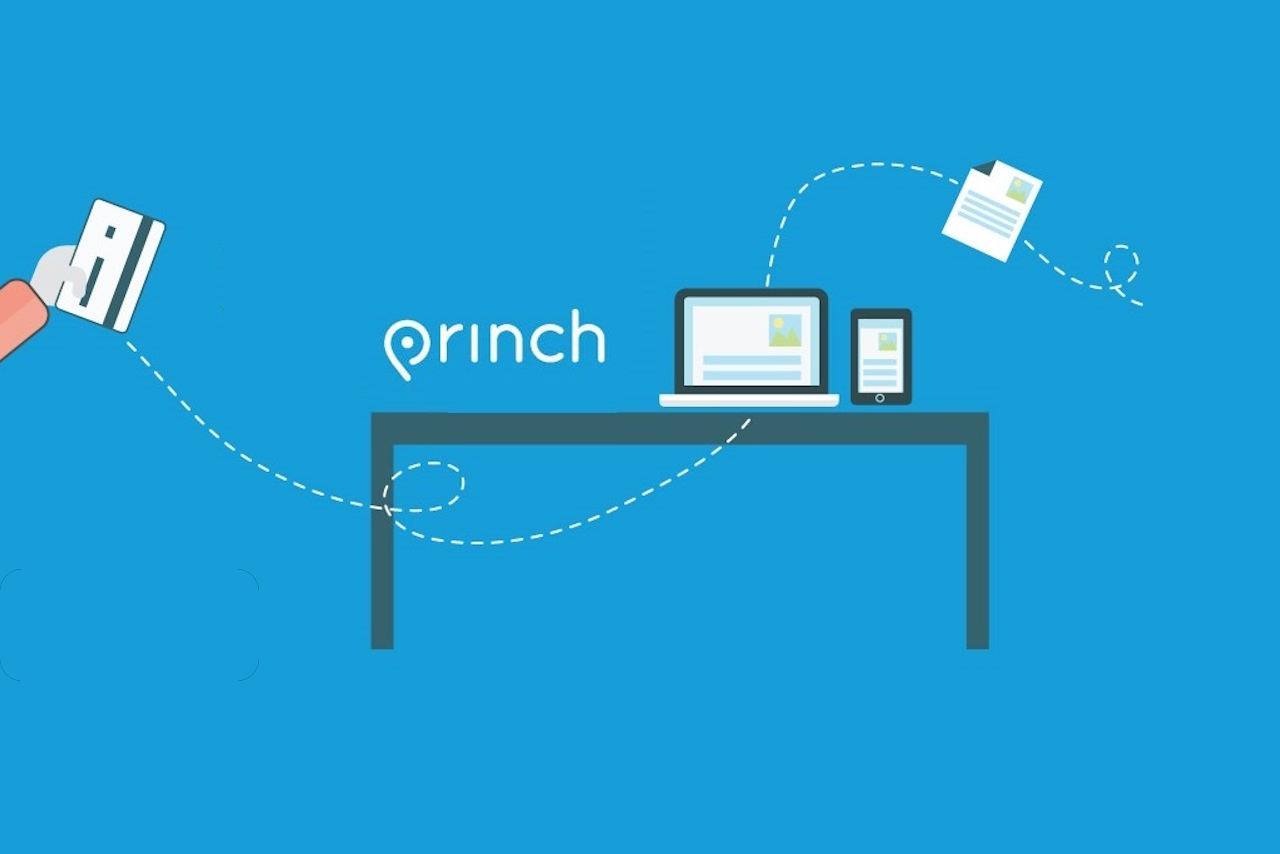 A hand holding a mobile device, sending a document to a printer on a table. Princh.